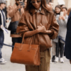 Shop Paris Street Style 2025 Zoe Saldaña Brown Jacket
